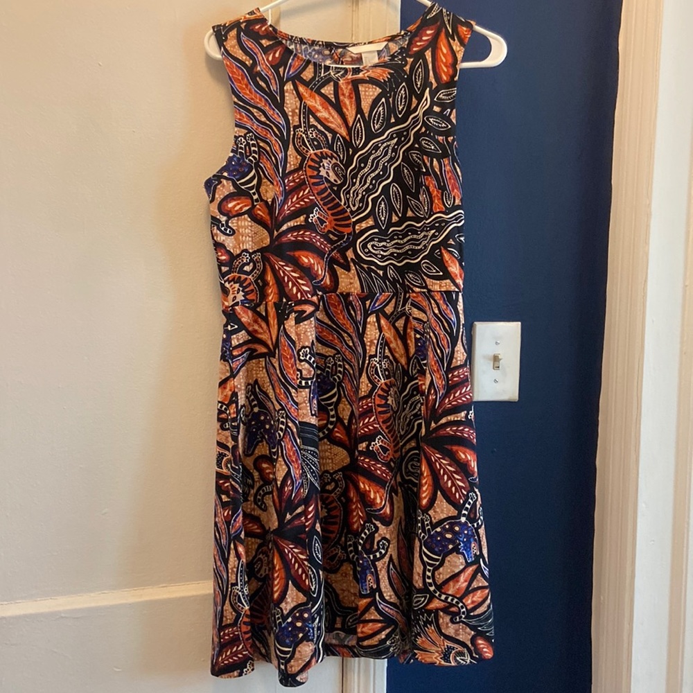 H&M dress. Diamond shape style in back.